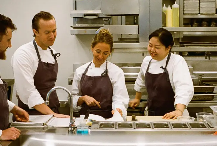 he cast and crew of The Bear work together in a professional kitchen