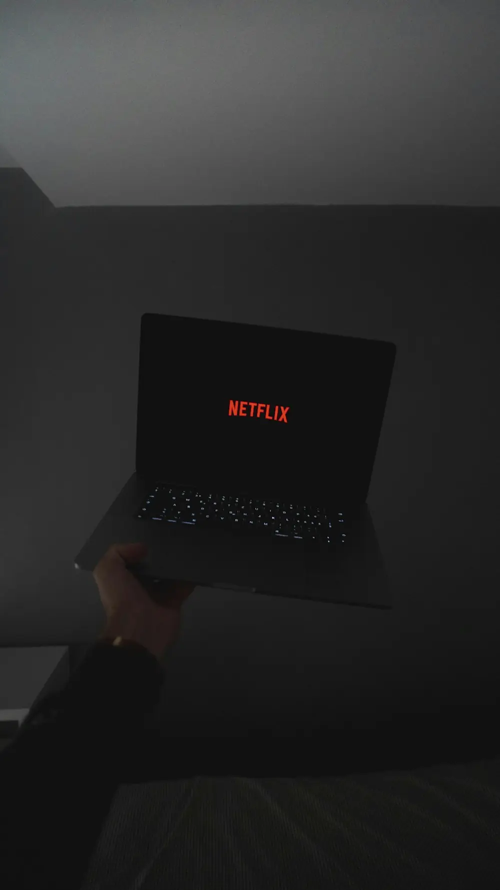 person holding black laptop computer